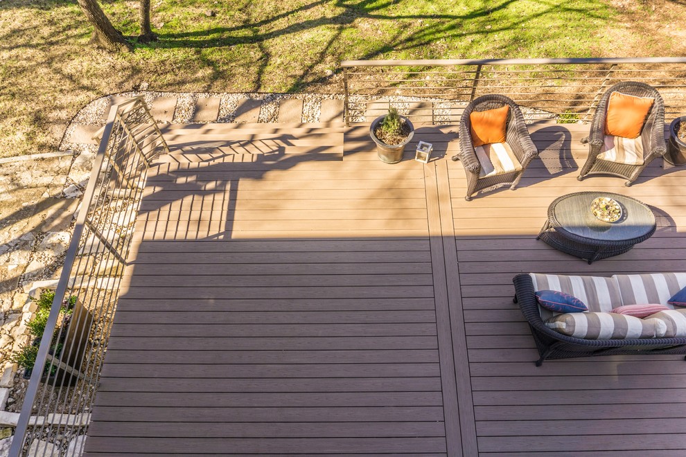 Inspiration for a large contemporary backyard deck remodel in Austin with no cover