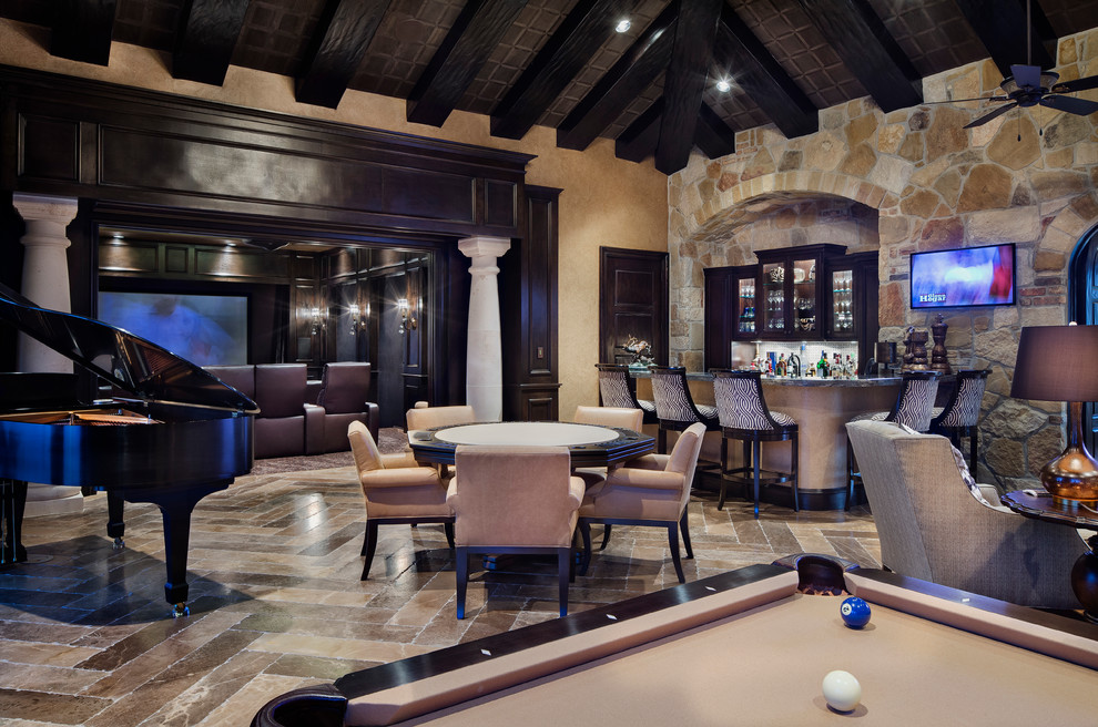 This is an example of a mediterranean open concept home theatre in Houston with a projector screen.