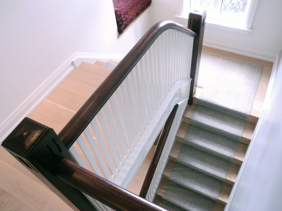 Inspiration for a contemporary carpeted u-shaped staircase in Toronto with carpet risers.