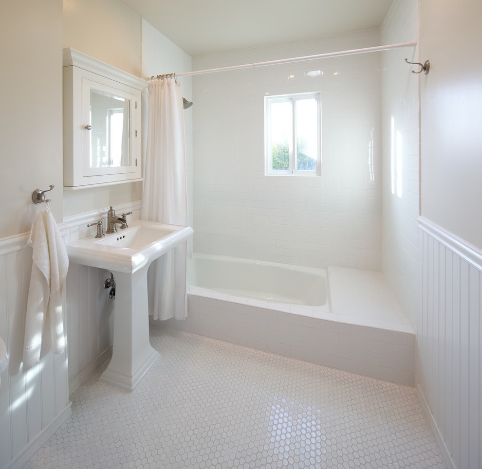 Contemporary bathroom in Los Angeles with a pedestal sink, subway tile and white floor.
