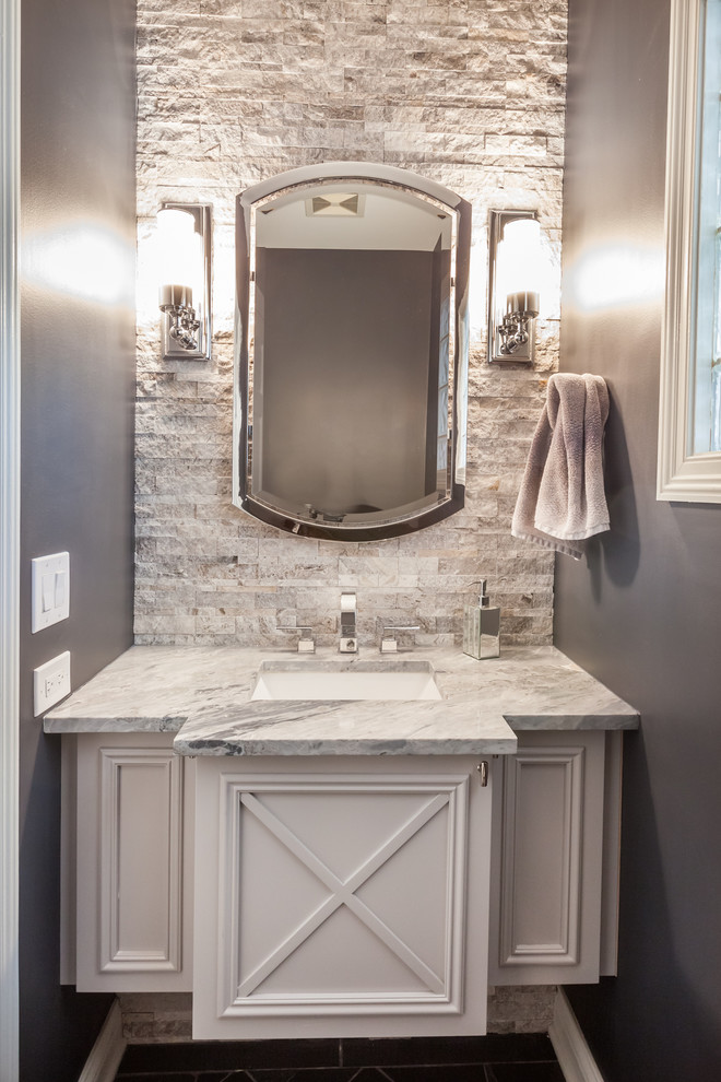 Small transitional powder room in Chicago with furniture-like cabinets, beige tile, stone tile, an undermount sink, quartzite benchtops and white cabinets.