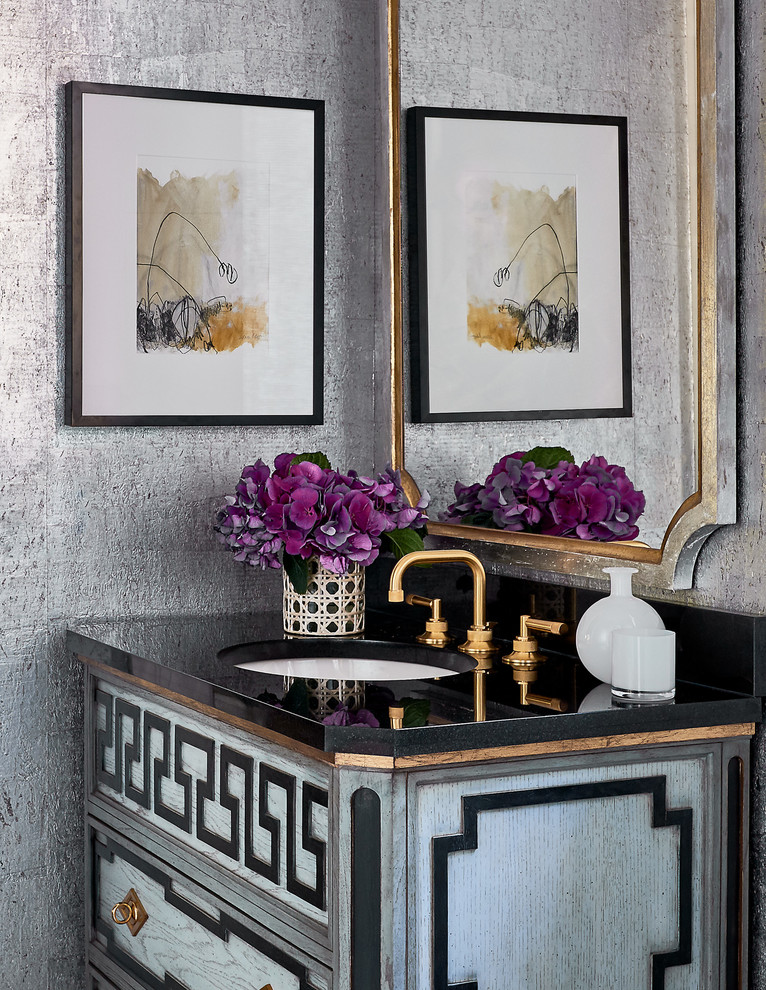 This is an example of a transitional powder room in Other with furniture-like cabinets, grey walls, grey cabinets, an undermount sink and black benchtops.