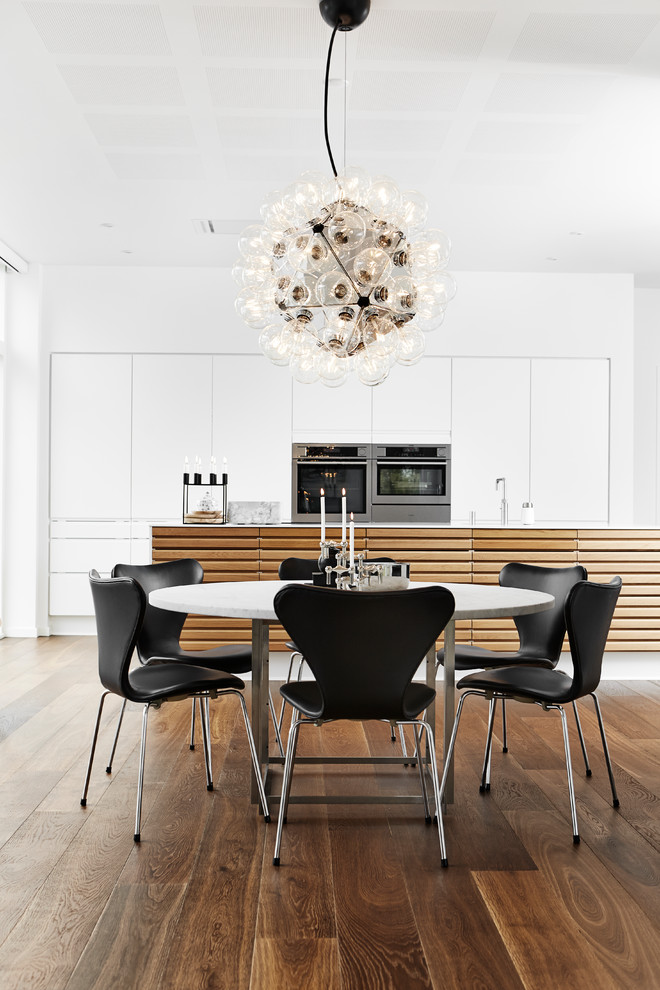 Photo of a large modern kitchen/dining combo in Aarhus with dark hardwood floors.