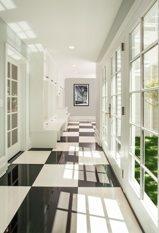 Large traditional hallway in Seattle with grey walls and porcelain floors.