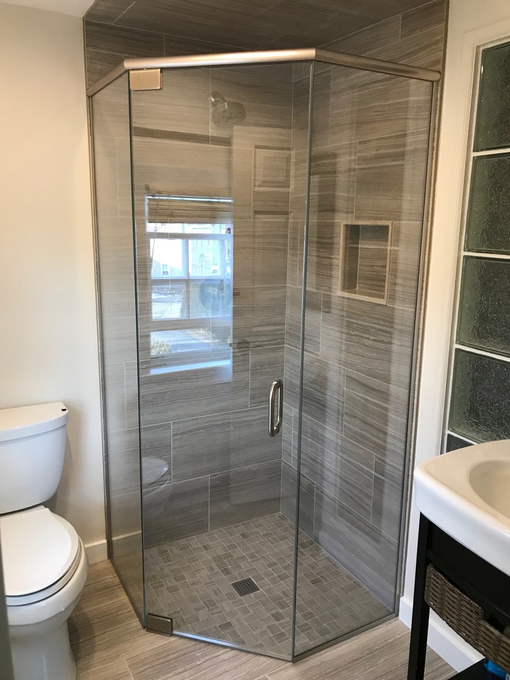 Design ideas for a contemporary bathroom in Boston with porcelain floors and a hinged shower door.