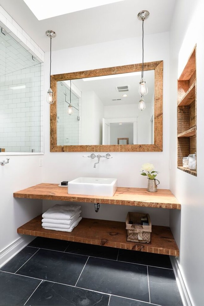 Small country 3/4 bathroom in Chicago with open cabinets, medium wood cabinets, a corner shower, white tile, subway tile, white walls, a vessel sink, wood benchtops and brown benchtops.