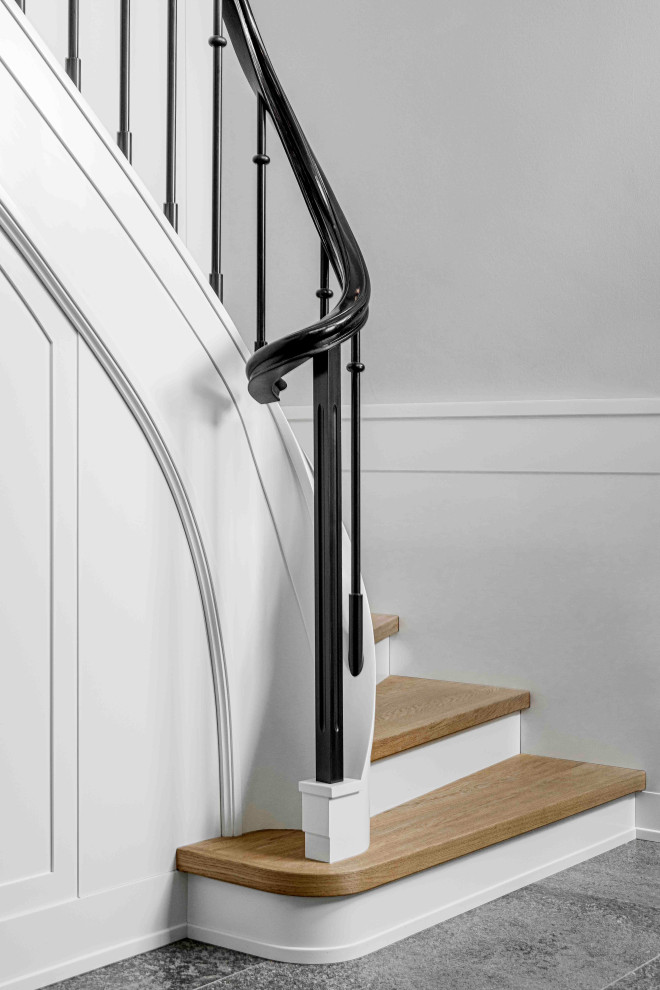 Inspiration for a medium sized traditional wood l-shaped metal railing staircase in Berlin with painted wood risers.