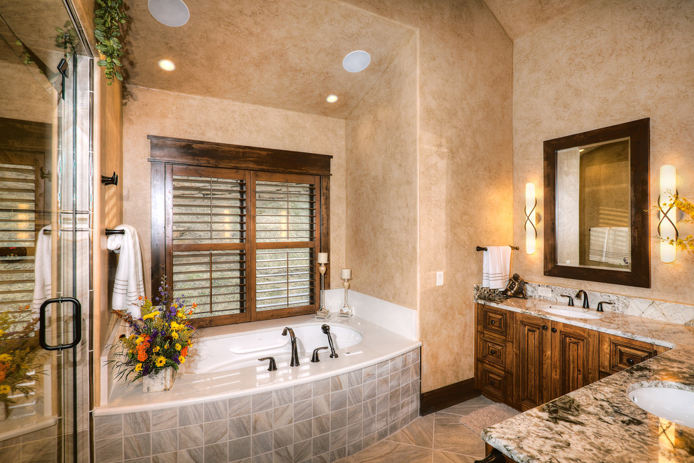 This is an example of a traditional bathroom in Denver with granite benchtops.
