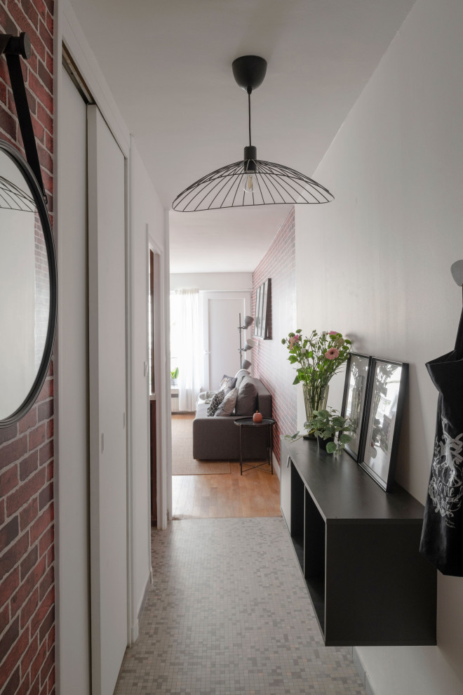 Small industrial entry hall in Lyon with white walls, ceramic floors, a single front door, a dark wood front door, grey floor and wallpaper.