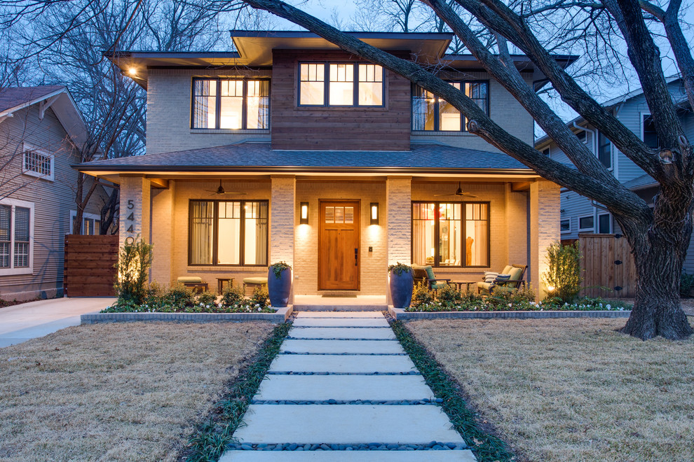 Design ideas for a contemporary exterior in Dallas with wood siding and a hip roof.