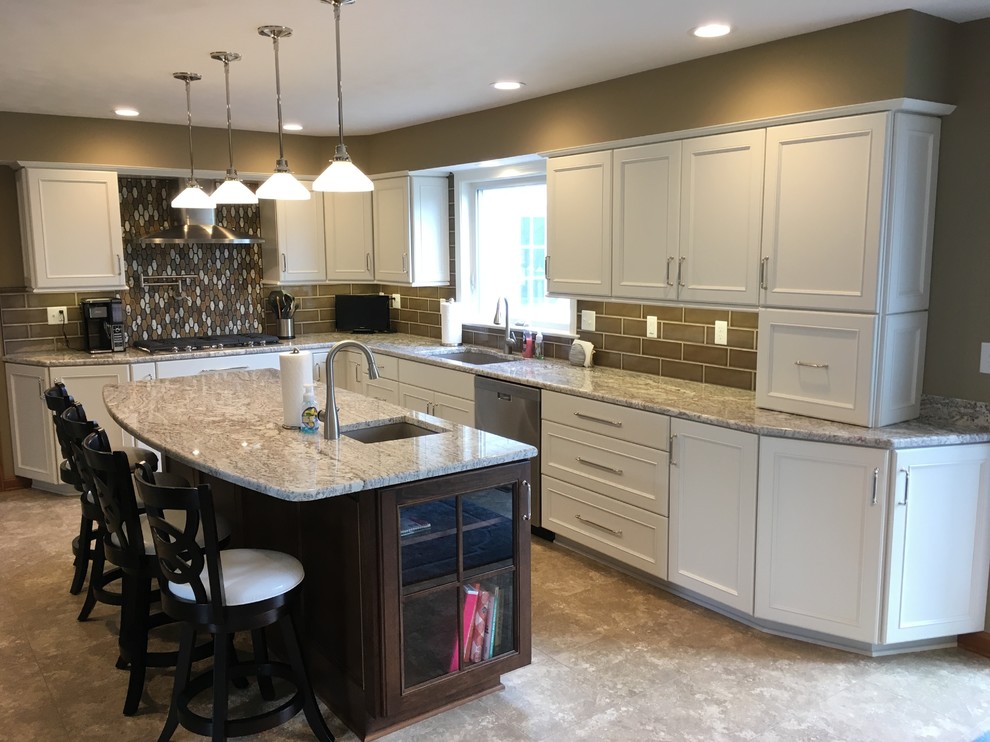 Inspiration for a large transitional l-shaped vinyl floor and beige floor eat-in kitchen remodel with a double-bowl sink, recessed-panel cabinets, white cabinets, granite countertops, brown backsplash, ceramic backsplash, stainless steel appliances and an island
