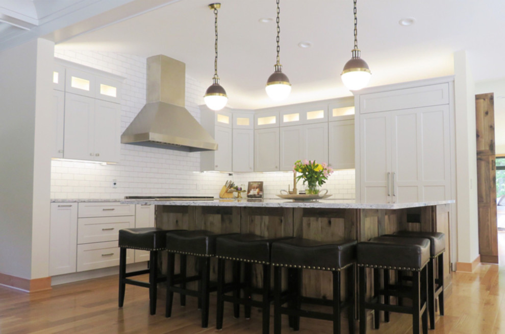 Example of a transitional kitchen design with beaded inset cabinets and medium tone wood cabinets