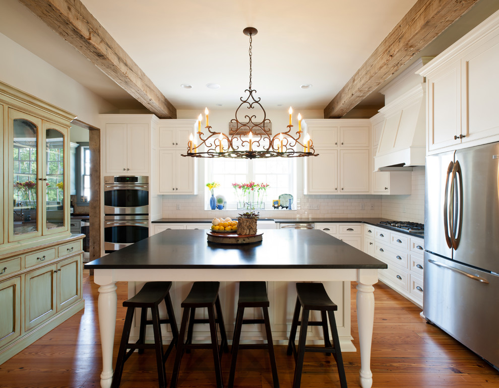 Inspiration for a traditional l-shaped separate kitchen in Nashville with recessed-panel cabinets, white cabinets and stainless steel appliances.