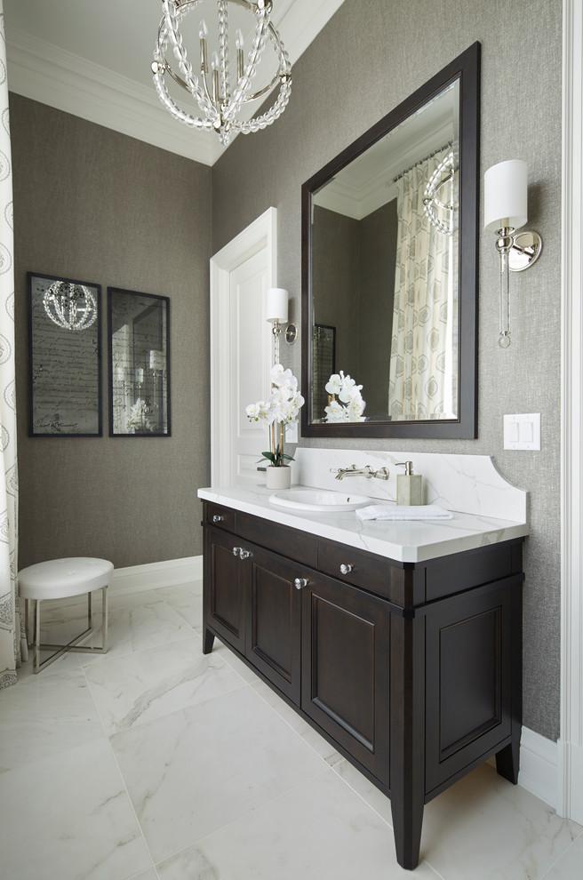 Large transitional powder room in Toronto with recessed-panel cabinets, black cabinets, grey walls, marble floors, a drop-in sink, quartzite benchtops and grey floor.