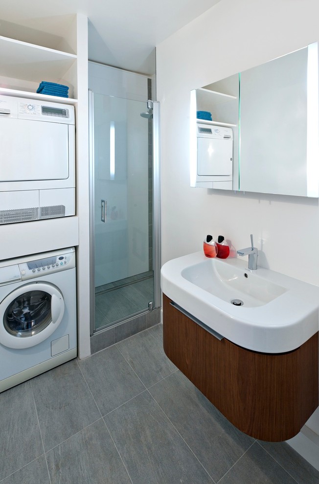 Photo of a contemporary bathroom in Other with a laundry.