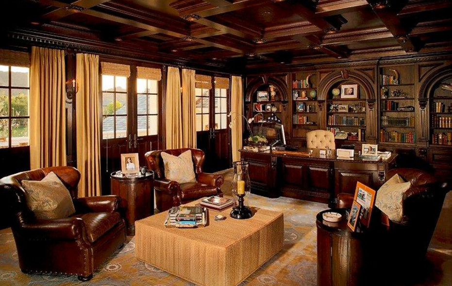 This is an example of a large arts and crafts study room in Phoenix with dark hardwood floors and a freestanding desk.