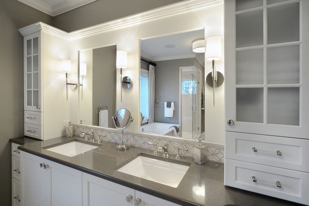 Inspiration for a large arts and crafts master bathroom in Boston with shaker cabinets, white cabinets, a freestanding tub, a corner shower, beige tile, limestone, beige walls, ceramic floors, an undermount sink, engineered quartz benchtops, beige floor and a hinged shower door.