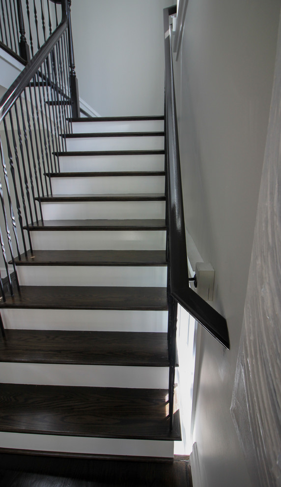 Example of a large transitional wooden l-shaped mixed material railing staircase design in DC Metro with painted risers