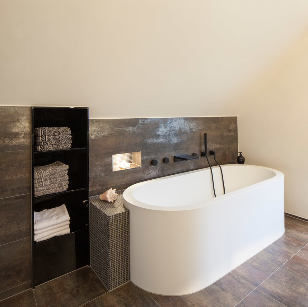Mid-sized contemporary master wet room bathroom in Cologne with a drop-in tub, brown tile, mosaic tile, beige walls, ceramic floors, brown floor, flat-panel cabinets, a trough sink, solid surface benchtops and a hinged shower door.
