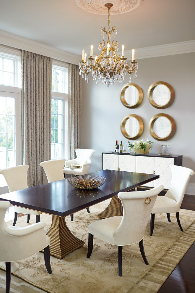 Transitional dining room in Houston with grey walls, dark hardwood floors and no fireplace.