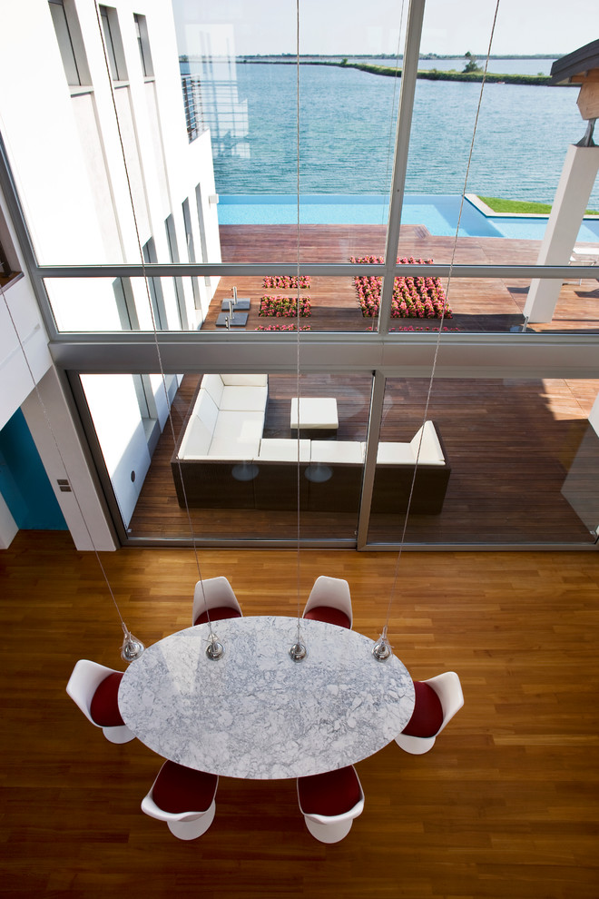 This is an example of a contemporary dining room in Venice.