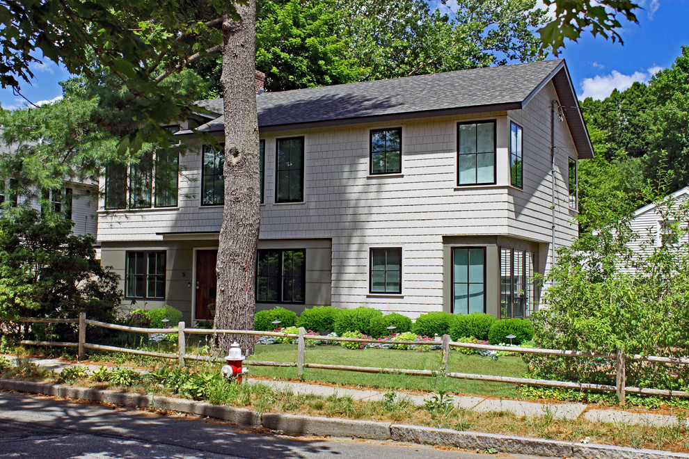 Large contemporary two-storey grey exterior in Boston with wood siding and a gable roof.