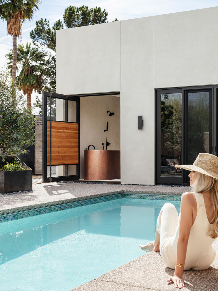Inspiration for a small courtyard rectangular pool in Phoenix with concrete slab.
