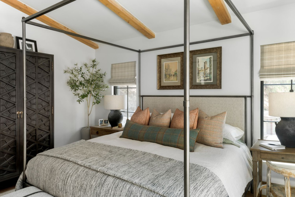 Mid-sized contemporary master bedroom in Los Angeles with white walls, medium hardwood floors and no fireplace.