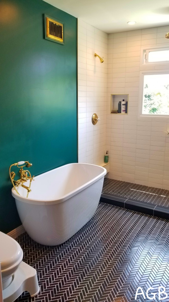 Mid-sized midcentury master bathroom in Los Angeles with raised-panel cabinets, brown cabinets, a freestanding tub, a double shower, a one-piece toilet, white tile, ceramic tile, green walls, porcelain floors, a drop-in sink, wood benchtops, black floor, a sliding shower screen and brown benchtops.