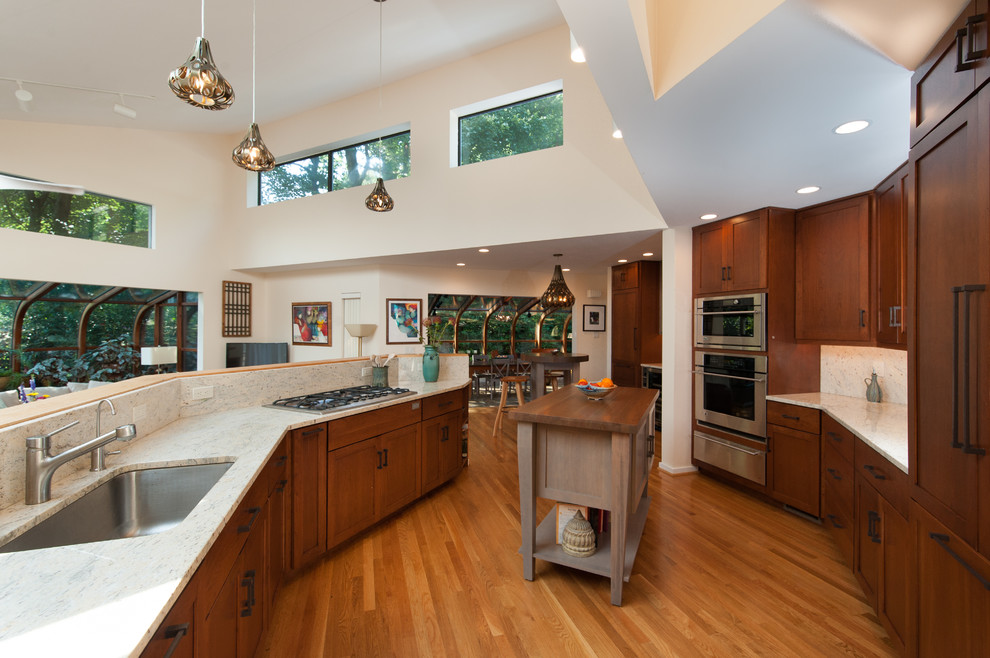 Inspiration for a large transitional kitchen remodel in DC Metro with an undermount sink, shaker cabinets, granite countertops, stainless steel appliances and an island