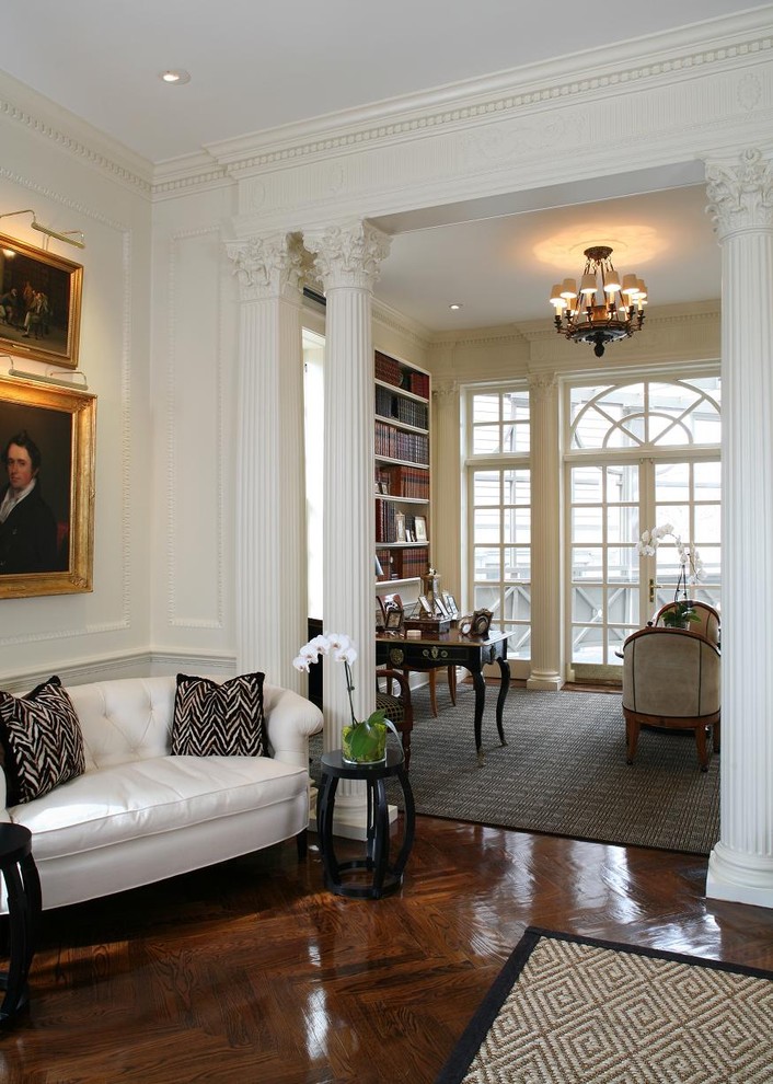 Design ideas for a traditional living room in DC Metro with a library.
