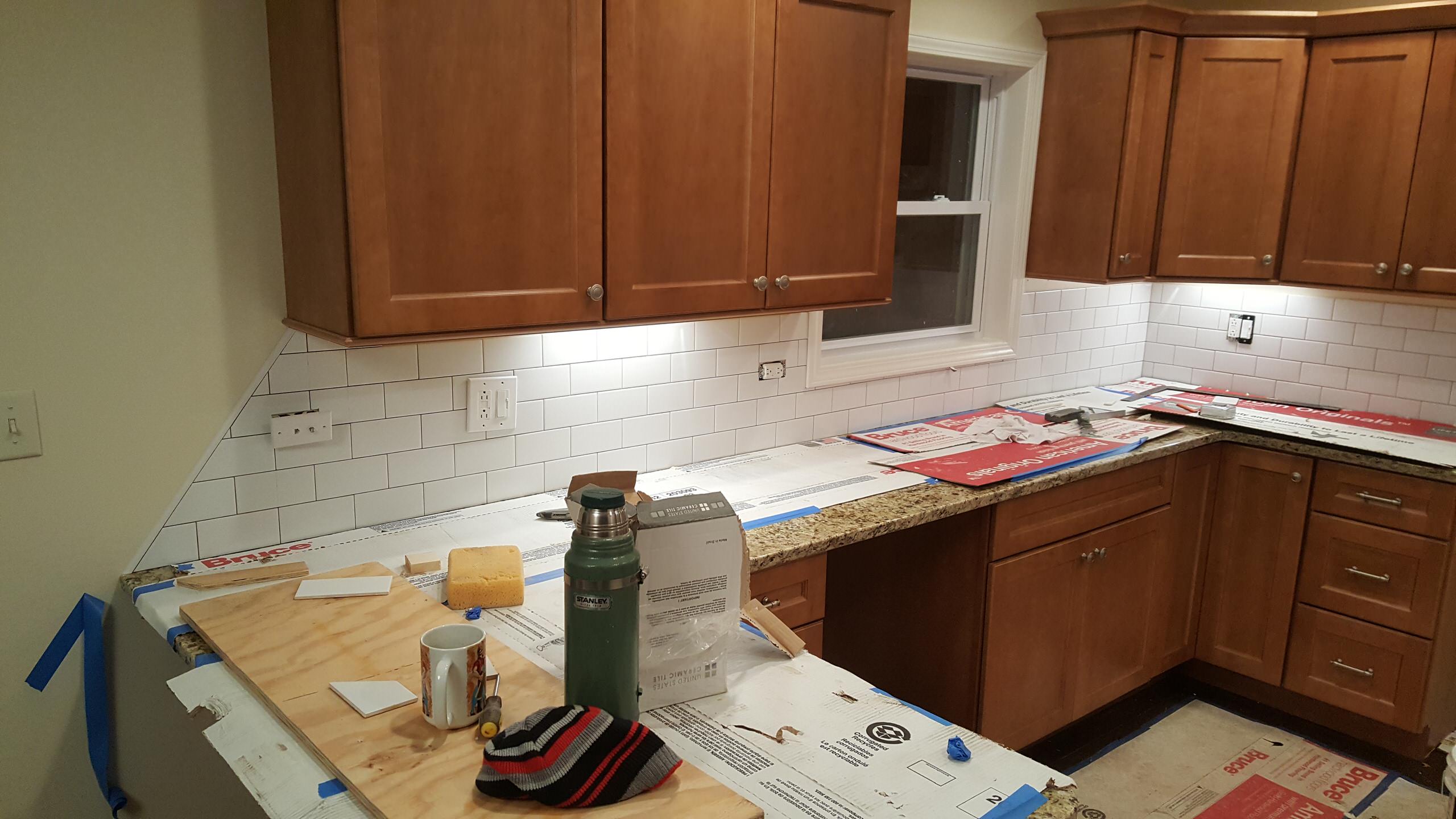 Installing a subway tile backsplash in a new kitchen