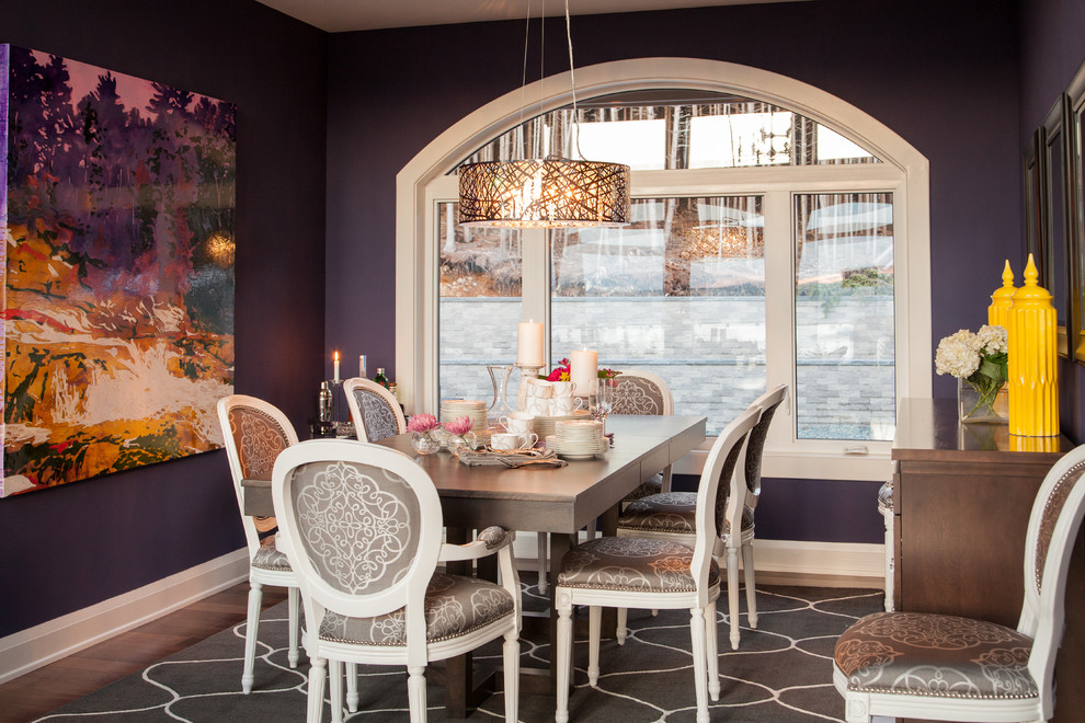 Contemporary dining room in Other with purple walls and dark hardwood floors.