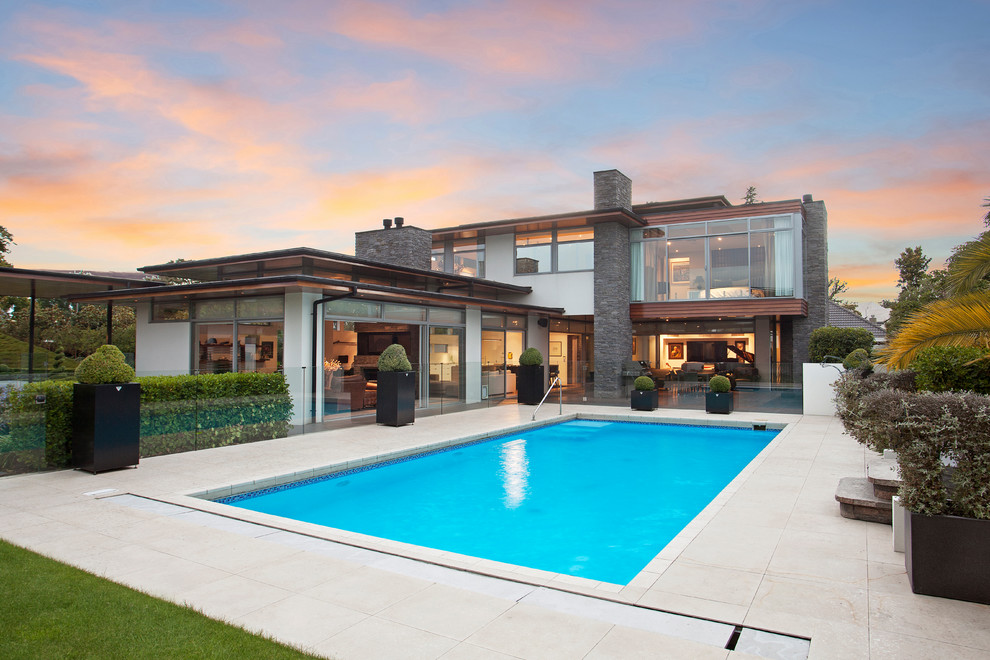 Inspiration for a contemporary backyard rectangular lap pool in Christchurch.