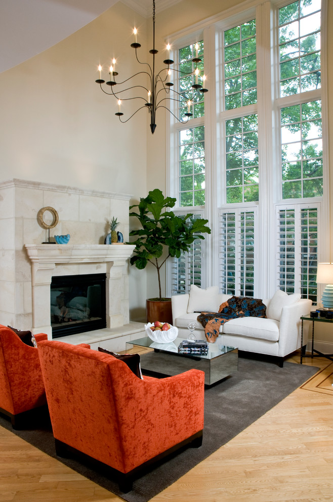 Inspiration for a contemporary living room in Chicago with medium hardwood floors, a standard fireplace and no tv.