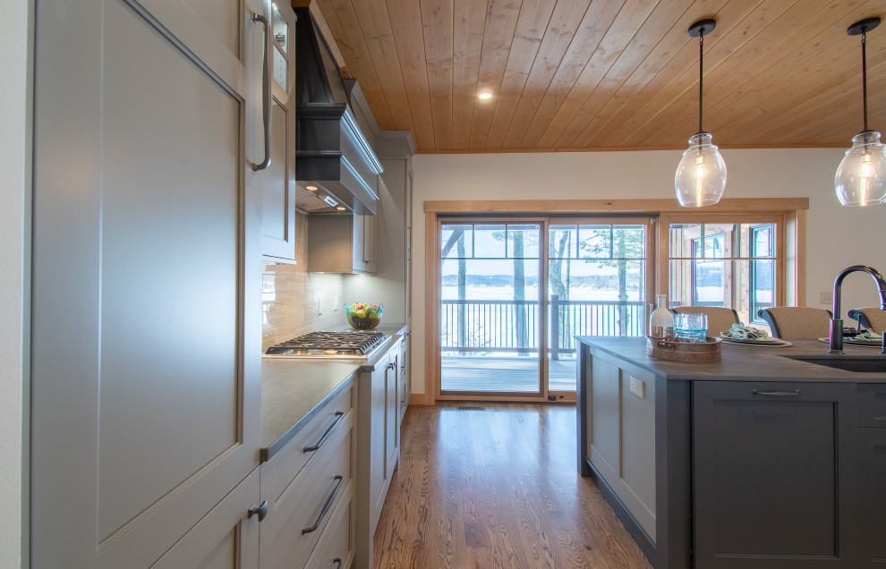 Inspiration for a rustic wood ceiling eat-in kitchen remodel in Seattle with gray cabinets, laminate countertops and two islands