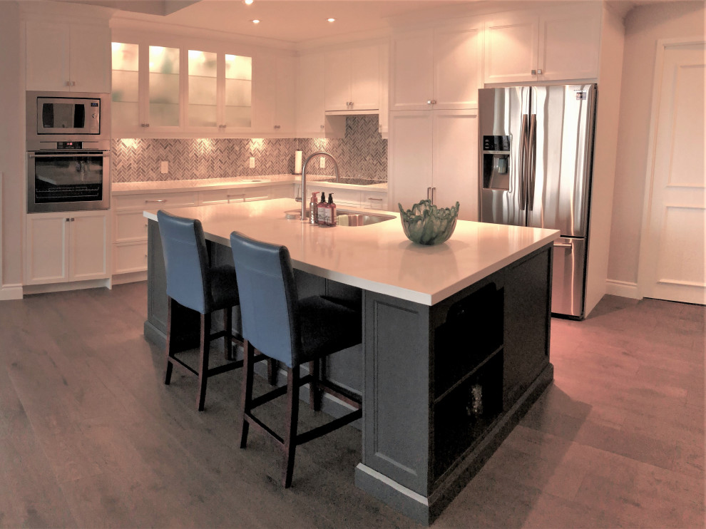 Inspiration for a large transitional l-shaped open concept kitchen remodel with an island