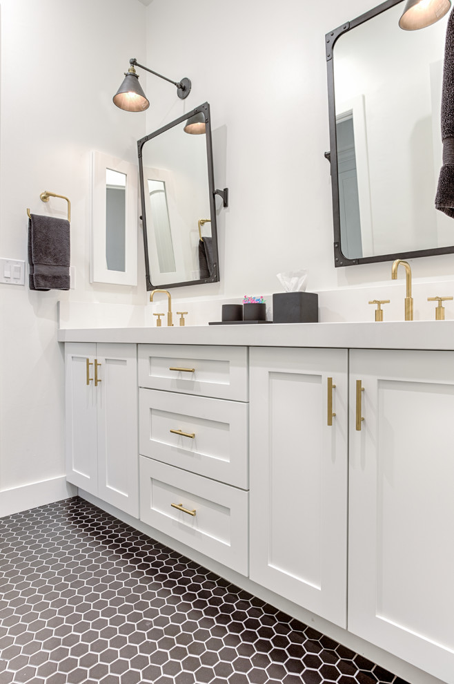 This is an example of a mid-sized transitional 3/4 bathroom in Phoenix with shaker cabinets, white cabinets, black and white tile, ceramic tile, white walls, ceramic floors, engineered quartz benchtops, black floor and white benchtops.