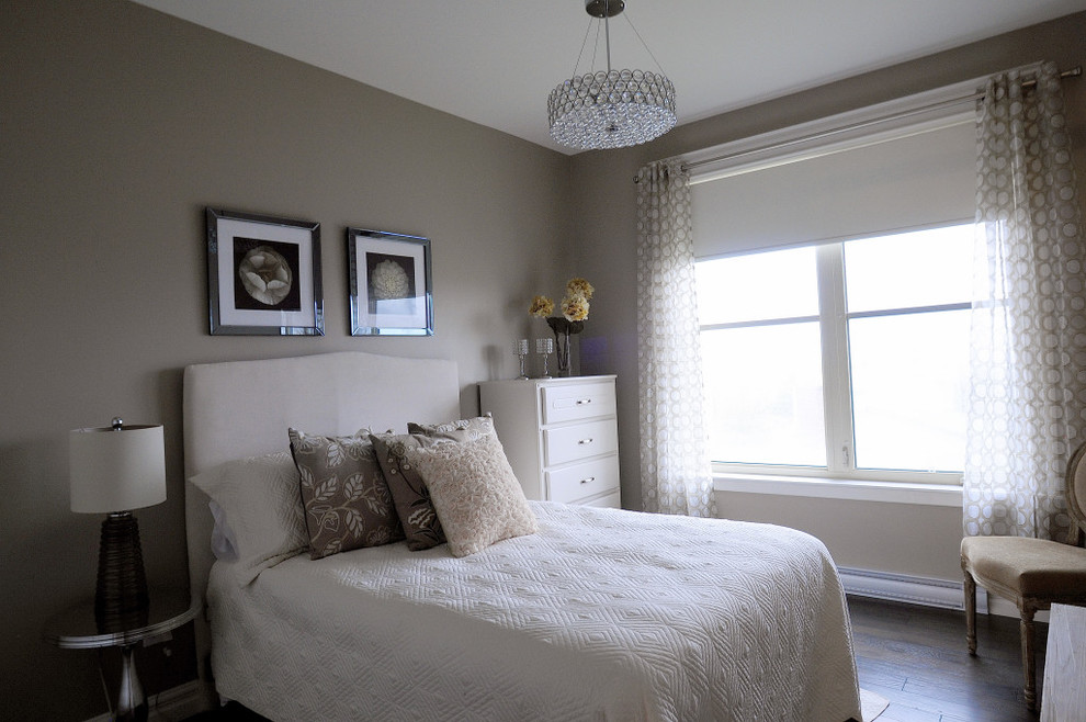 Photo of a contemporary bedroom in Other with grey walls and dark hardwood floors.
