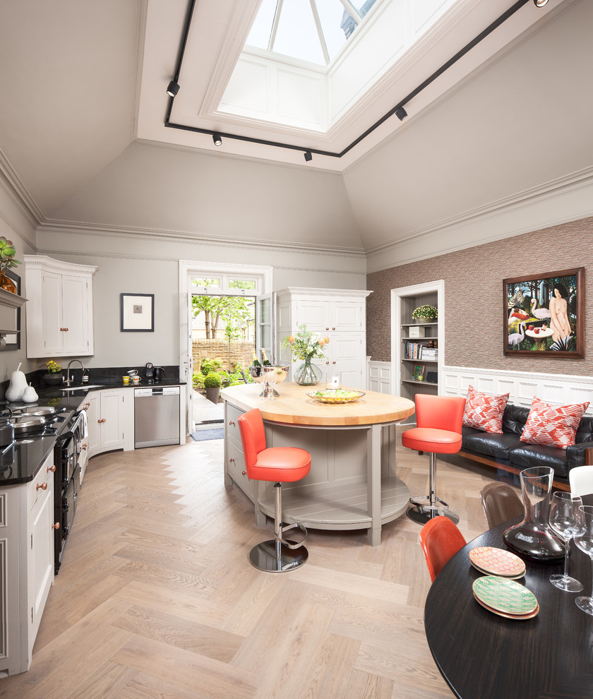 Inspiration for a large transitional l-shaped kitchen in Edinburgh with an undermount sink, recessed-panel cabinets, grey cabinets, stainless steel appliances, with island and black benchtop.