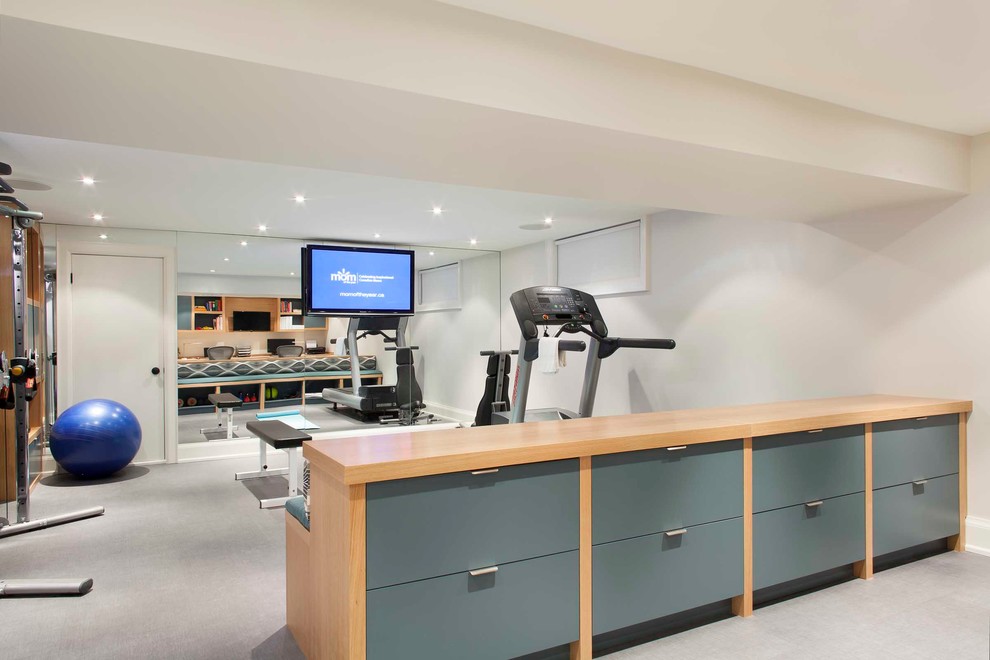 Photo of a large contemporary multipurpose gym in Toronto with white walls, vinyl floors and grey floor.