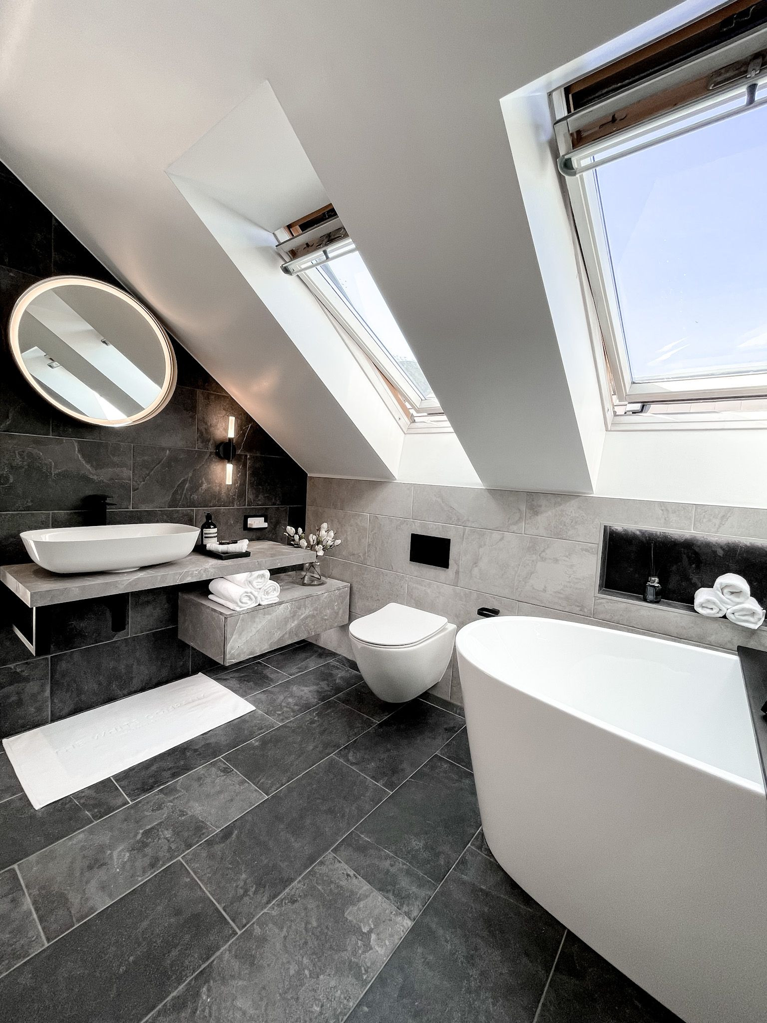 Luxurious Loft Bathroom with Freestanding Tub and Skylight Design