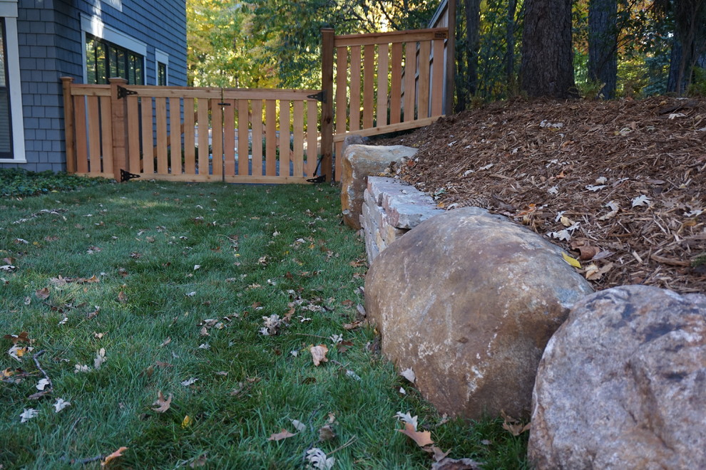 This is an example of a mid-sized rustic shade side yard garden path in Minneapolis.