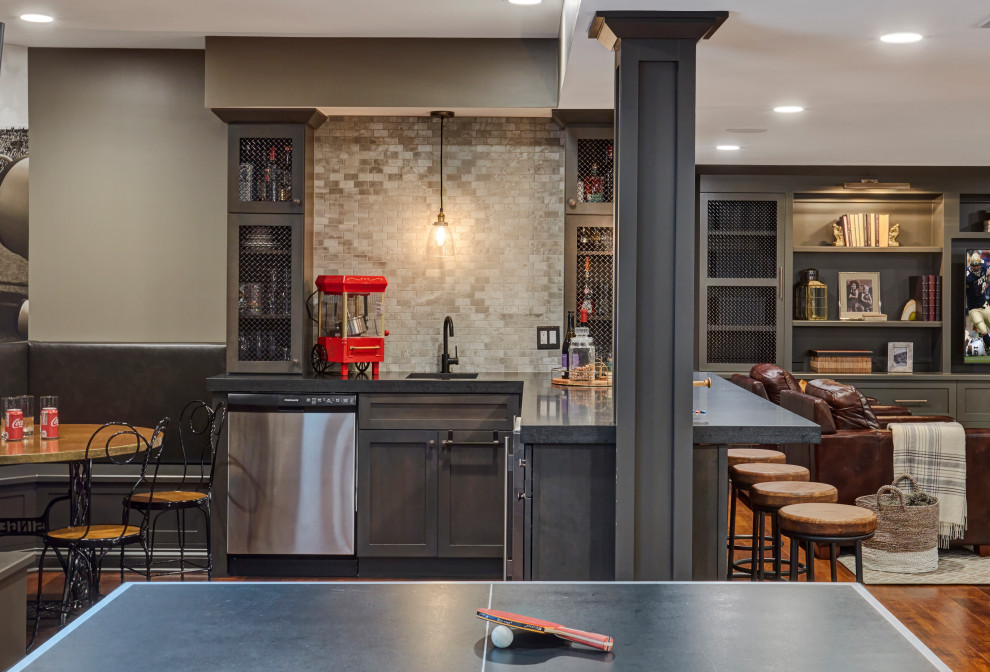 Transitional dark wood floor and brown floor basement photo in Chicago with gray walls
