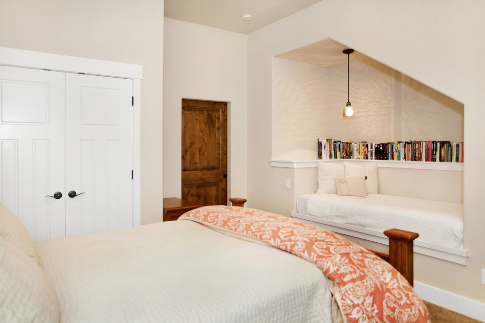 Inspiration for a mid-sized arts and crafts guest bedroom in Denver with beige walls, carpet and beige floor.