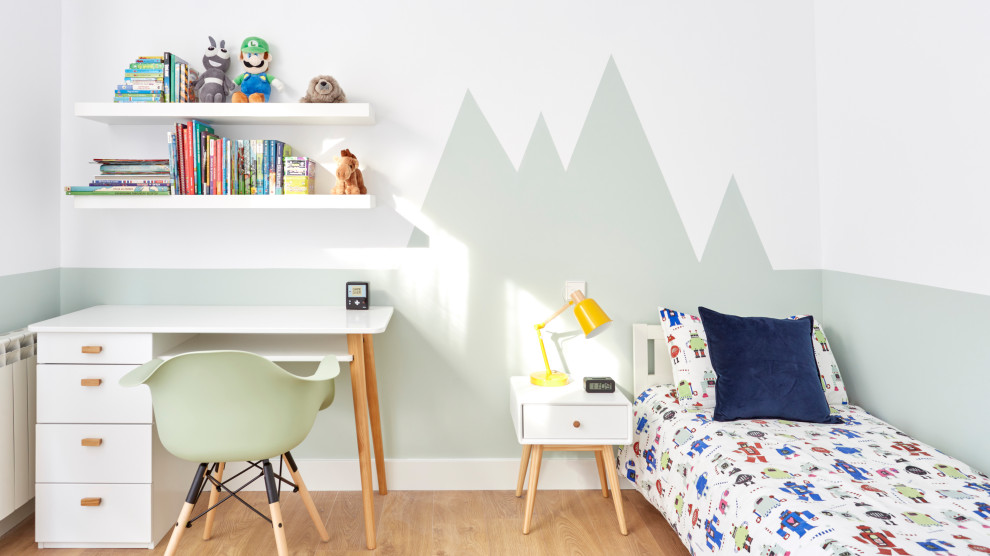 Design ideas for a mid-sized contemporary gender-neutral kids' study room for kids 4-10 years old in Madrid with green walls, light hardwood floors and beige floor.