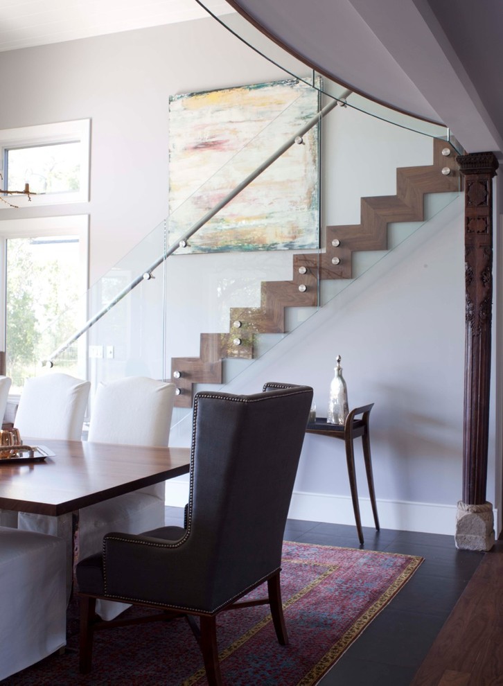 This is an example of an eclectic dining room in Denver.