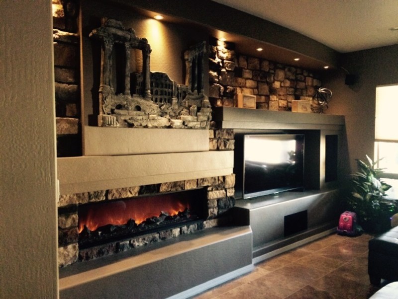 Inspiration for a large modern open concept living room remodel in Phoenix with beige walls, a stone fireplace and a wall-mounted tv