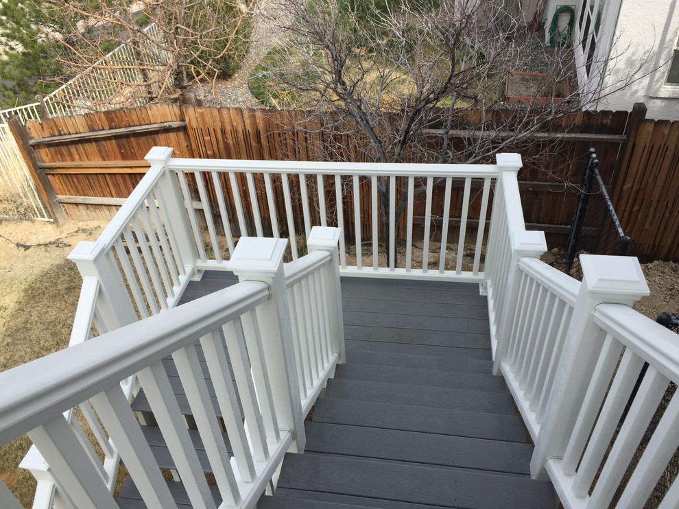Inspiration for a mid-sized transitional backyard deck remodel with no cover
