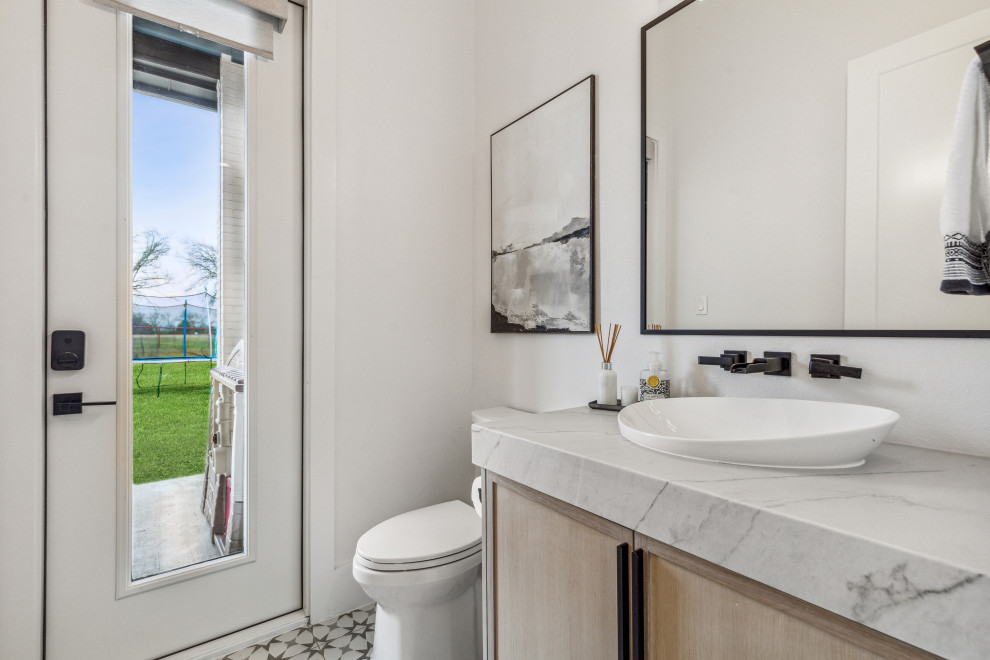 Medium sized contemporary cloakroom in Dallas with shaker cabinets, light wood cabinets, a two-piece toilet, white walls, mosaic tile flooring, a vessel sink, quartz worktops, multi-coloured floors, grey worktops and a floating vanity unit.